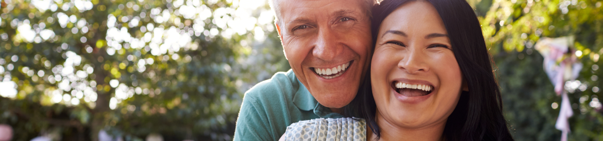 smiling couple with dental implants